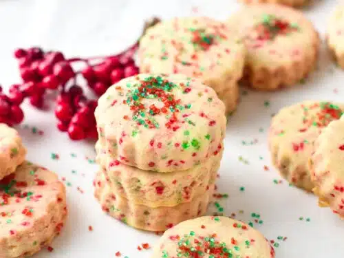 These Homemade Jingles Cookies are delicious buttery shortbread with a touch of anise extract and lovely red and green sugar sprinkles. They are the perfect holiday shortbread for Christmas.